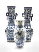 Pair of 20th Century Chinese blue and white vases decorated with flowers and with elephant head han