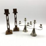 Pair Art Deco oak candlesticks with open twist stems on stepped bases and a pair of Falstaff silver