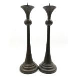 Pair of bronzed candlesticks, knopped stems on a tapered circular foot, H51cm