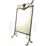 Early 20th century brass framed mirrored fire screen of Art Nouveau design on splay feet 80cm x 48