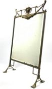 Early 20th century brass framed mirrored fire screen of Art Nouveau design on splay feet 80cm x 48