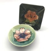 Moorcroft Anemone pattern pin dish with small foot D11cm and a Hibiscus pattern ashtray on green gr