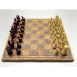 Leather chess board and set of composition chess pieces modelled as figures from the battle of Wate