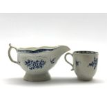 18th Century Caughley strap fluted sauce boat decorated in blue with a spray of flowers within a fl