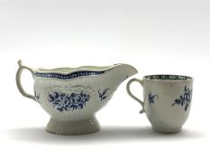 18th Century Caughley strap fluted sauce boat decorated in blue with a spray of flowers within a fl