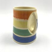 Susie Cooper 'Crown Works Burslem' tankard with integral handle and concentric decoration in orange