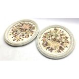 Pair of oval pressed flower pictures in white and gilt frames 30cm x 25cm