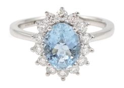 18ct white gold oval aquamarine and diamond cluster ring, hallmarked