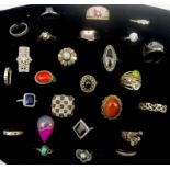 Collection of twenty-five silver and stone set silver rings including goldstone, garnet, cubic zirco