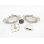 Pair of pierced silver oval sweetmeat dishes Chester 1933, silver matchbox holder, vesta case and a