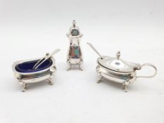 Silver three piece condiment set with blue glass liners and three various spoons Birmingham 1923 Mak