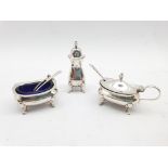 Silver three piece condiment set with blue glass liners and three various spoons Birmingham 1923 Mak