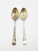 Pair of 18th Century silver table spoons, later decorated and gilded with berry bowls and engraved s