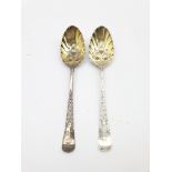 Pair of 18th Century silver table spoons, later decorated and gilded with berry bowls and engraved s