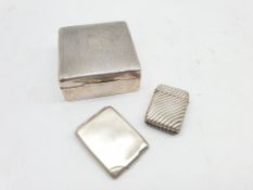 Engine turned square silver cigarette box Birmingham 1930 , silver match book holder and a silver v