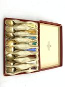 Set of eight Norwegian silver gilt and coloured enamel coffee spoons by David Andersen in original b