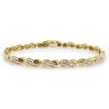 Gold baguette diamond link bracelet, stamped 14K