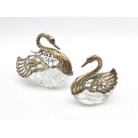 Pair of graduated glass Swan salts with pierced silver hinged wings and neck, import marks, larger s