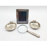 Small silver 999 standard table photograph frame 10cm x 8cm,, magnifying glass with silver handle an