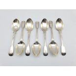 Set of seven Victorian silver fiddle and thread pattern dessert spoons engraved with a crest London