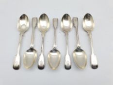 Set of seven Victorian silver fiddle and thread pattern dessert spoons engraved with a crest London