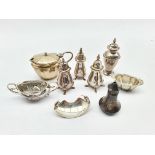 Pair of silver pepperettes Birmingham 1942, two others, silver mustard pot, two silver salts and oth