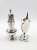 George III silver sugar caster London 1763 Maker I D and an early 19th Century cream jug on a square