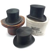 Black top hat by Hyam & Co Leeds, another in a Victorian leather hat box and another by Christy's Lo