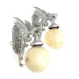 Pair of modern cast metal wall lights, each modelled as a winged dragon with globular shades, H68cm