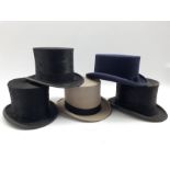 Grey top hat by Bates of London in leather case, two black top hats by Lock & Co., another by Christ