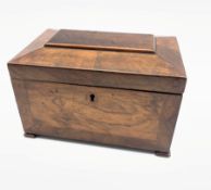 Late Georgian walnut tea caddy of sarcophagus design, the interior in burr elm, walnut and rosewood