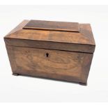 Late Georgian walnut tea caddy of sarcophagus design, the interior in burr elm, walnut and rosewood