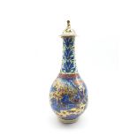 19th/ 20th century Chinese bottle vase and cover decorated with figures in a mountainous landscape,