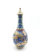 19th/ 20th century Chinese bottle vase and cover decorated with figures in a mountainous landscape,