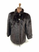 German brown mink jacket with silk pattern lining, cuffs with buttons and stand-up collar