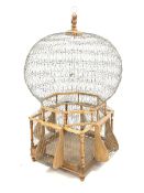 Very large decorative wire work bird cage, of bulbous form on wooden base, H154cm