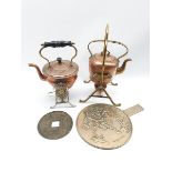 Two copper and brass spirit kettles, Japanese hand mirror and a large Chinese coin/token with centra