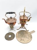 Two copper and brass spirit kettles, Japanese hand mirror and a large Chinese coin/token with centra