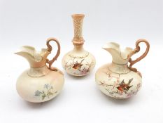 Pair of Locke and Co Worcester jugs painted with birds and flowering branches on a blush ivory groun