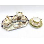 Noritake dressing table set decorated with a lake landscape within a blue and gilt border, seven pie