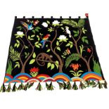 Jan Constantine Tropical Paradise embroidered wool wall hanging on black ground with tabs and tassel