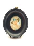 Miniature oval head and shoulders portrait of a fashionable lady in a large hat and in ebonised fram