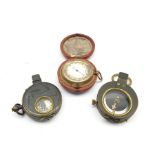 World War I marching compass in a leather case inscribed C & R Brinsley 1916, another and a pocket b