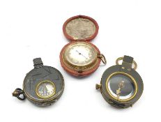 World War I marching compass in a leather case inscribed C & R Brinsley 1916, another and a pocket b