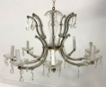 20th century eight branch glass and gilt metal chandelier with prism glass drops H44cm and a matchi