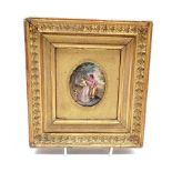 Miniature enamelled oval plaque of depicting a Family walking in a woodland, H7.5cm in a gilt frame