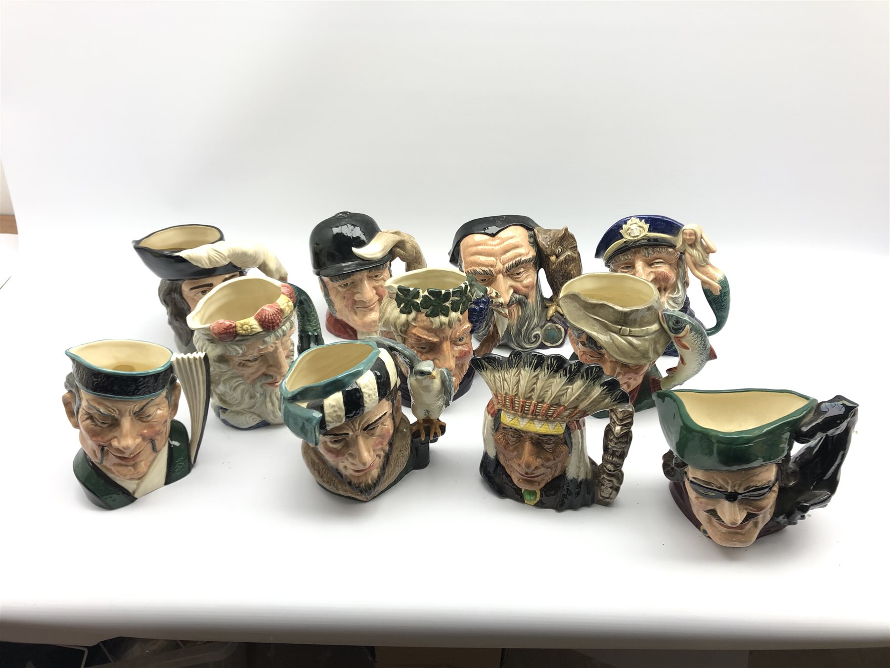 Eleven Royal Doulton character jugs comprising: North American Indian, Dick Turpin, Bacchus, The Poa - Image 2 of 2