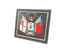 George V embroidered panel with photograph of the King, Royal Standards etc 38cm x 47cm