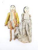 Two peg dolls with carved limbs and painted rounded faces H27cm