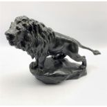 Early 20th century bronzed lion standing on rocky base after Gyorgy Vastagh, signed in the cast 44cm